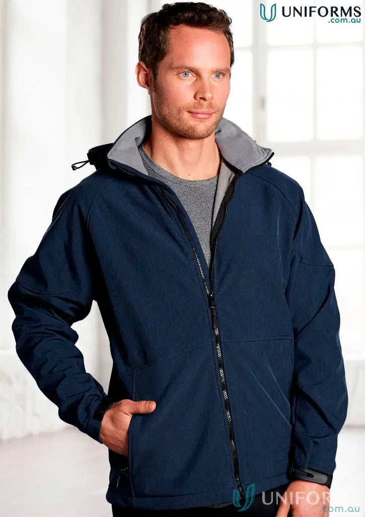 Man in navy blue JK33 Aspen Softshell Hood Jacket with grey collar and black zippers