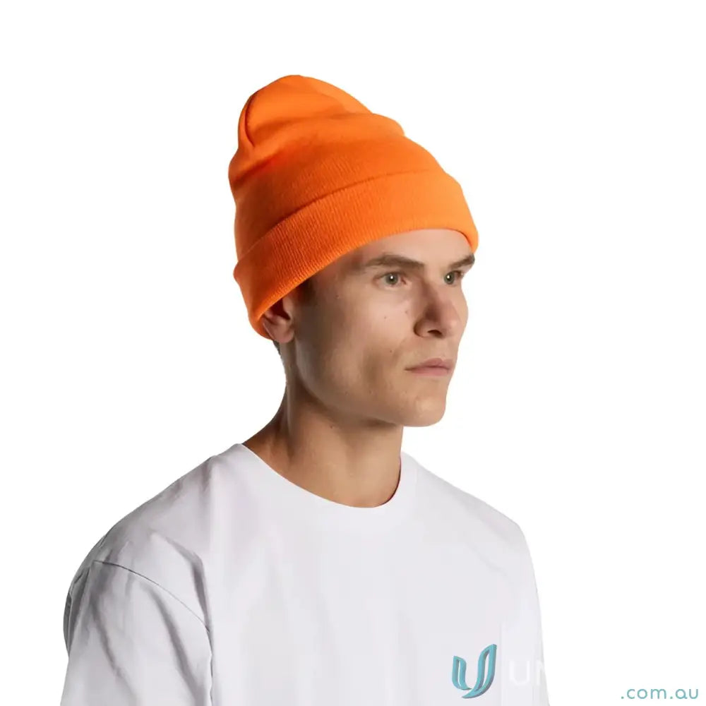 Person wearing a bright orange high visibility relaxed fit tight knit beanie