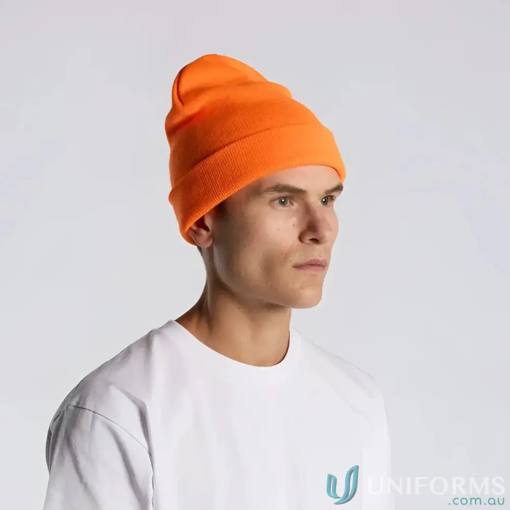 Man in bright orange high visibility knit beanie with relaxed fit and white t-shirt