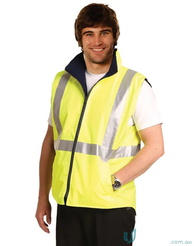 Smiling man in bright yellow HiVis Hooded Puffer Vest, perfect for construction workers workwear
