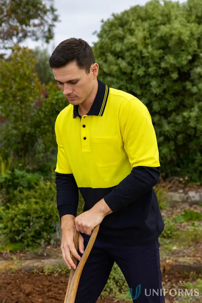 Man wearing HiVis LS Cotton Polo in yellow and navy with UPF protection and 180gsm fabric