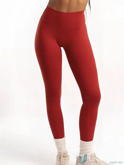 Red high-waisted invicible scrunch cherry leggings with smooth fabric perfect for workwear and uniforms