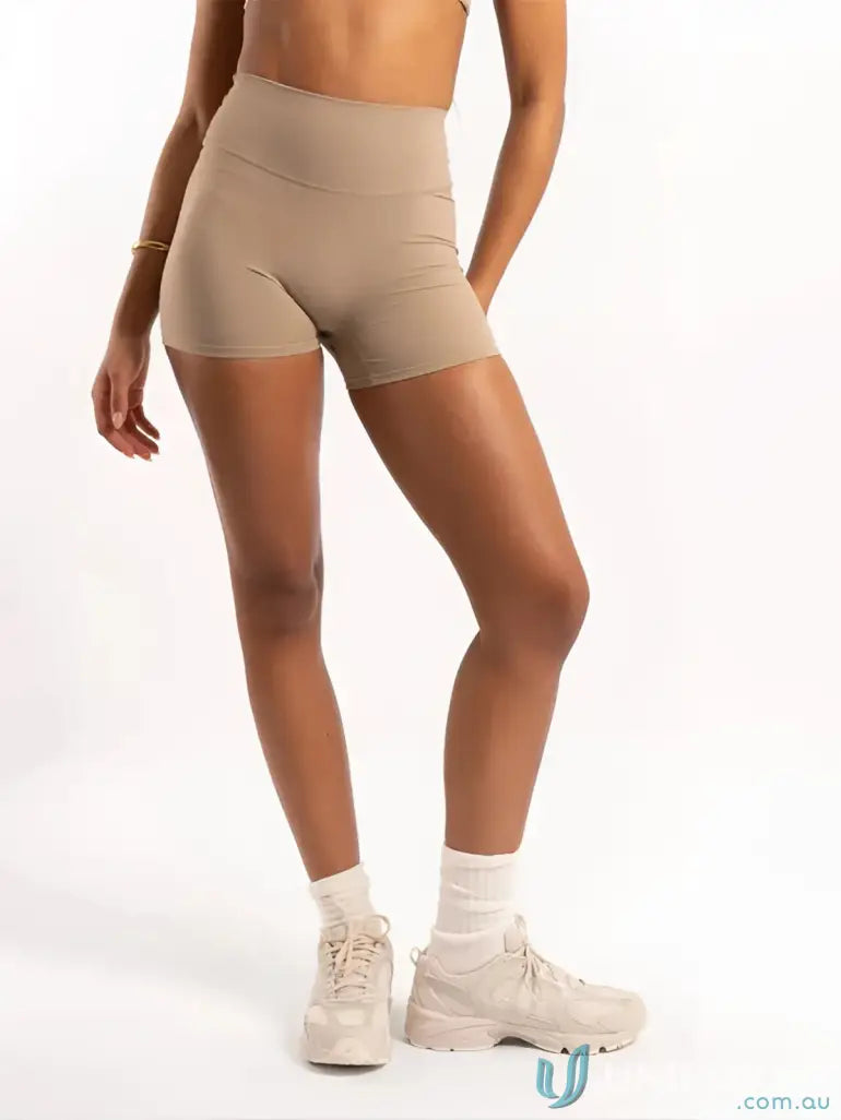 Beige high waisted invisible scrunch latte shorts with smooth stretchy fabric perfect for workwear uniforms