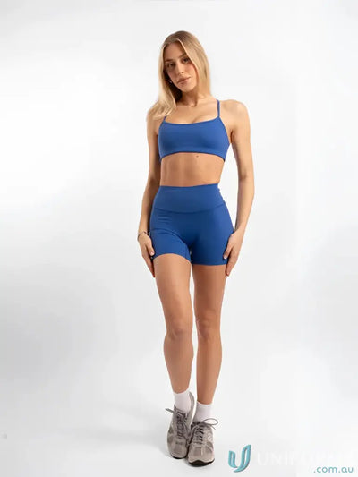 Blue invisible scrunch riviera shorts two-piece uniform set with stretchy crop top and high-waisted workwear shorts