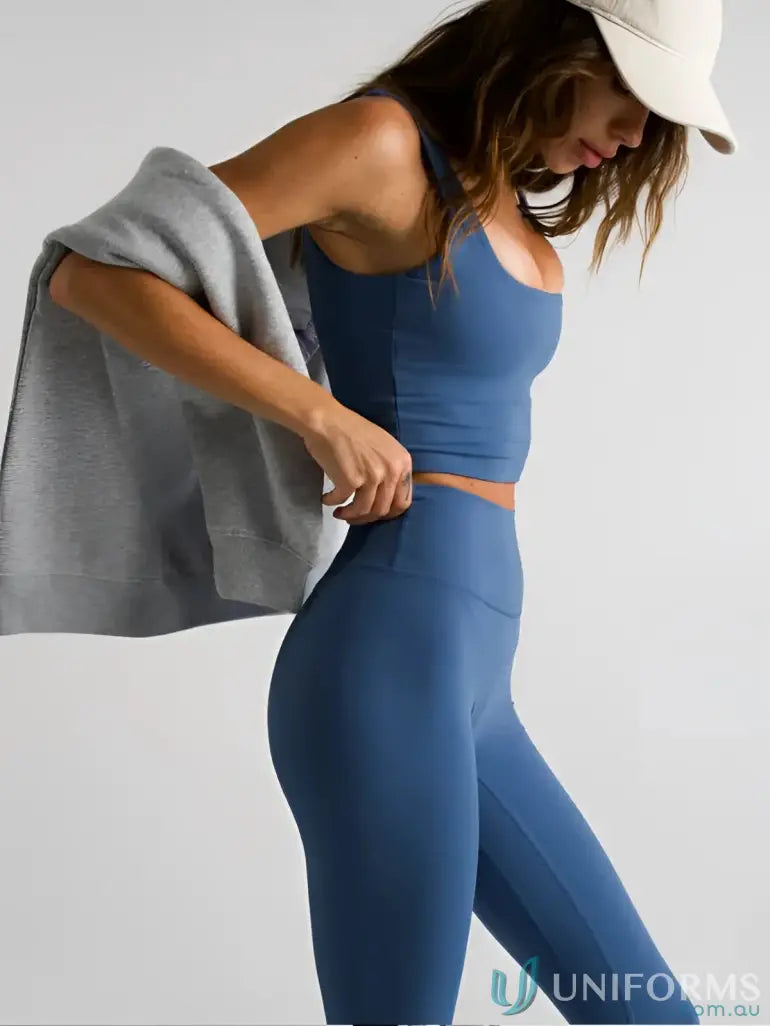 Blue athletic two-piece set with invincible scrunch slate leggings perfect for comfy workwear or active uniforms
