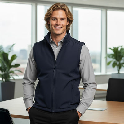 JBs layer softshell vest in navy blue with hood, pockets over gray shirt