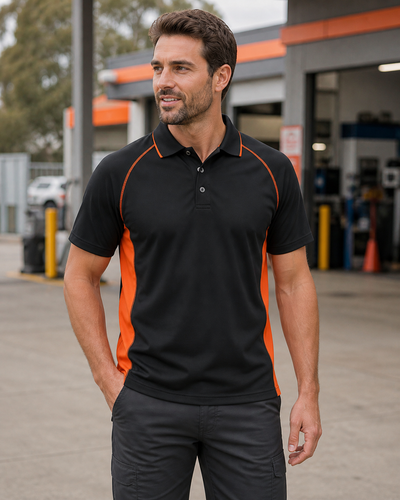 Male model wearing black and orange JB's Podium Cover Polo