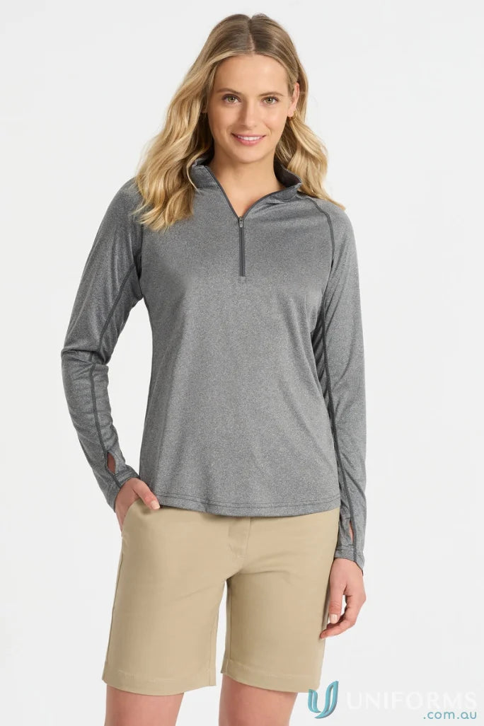 Ladies Apex Baselayer showing stylish gray long-sleeved shirt and khaki shorts
