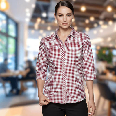 Woman in Brighton lady shirt, red white checkered 3Q sleeves