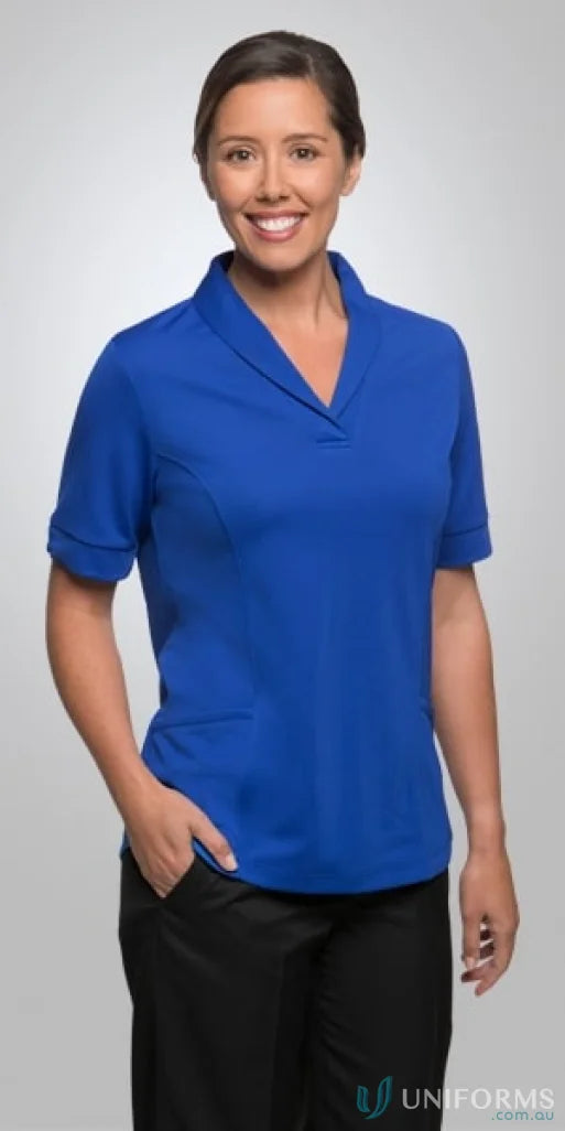 Woman in blue collared shirt and black pants wearing Ladies City Health Active Top roll collar workwear