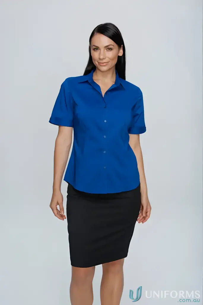 Woman in blue Mosman SS shirt and black skirt, perfect workwear or uniform look