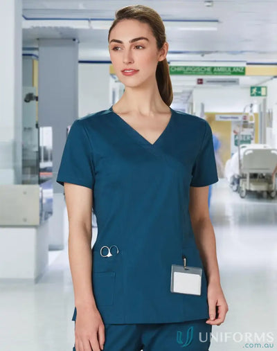 Winning spirit ladies teal scrub top with pockets, perfect for healthcare professionals