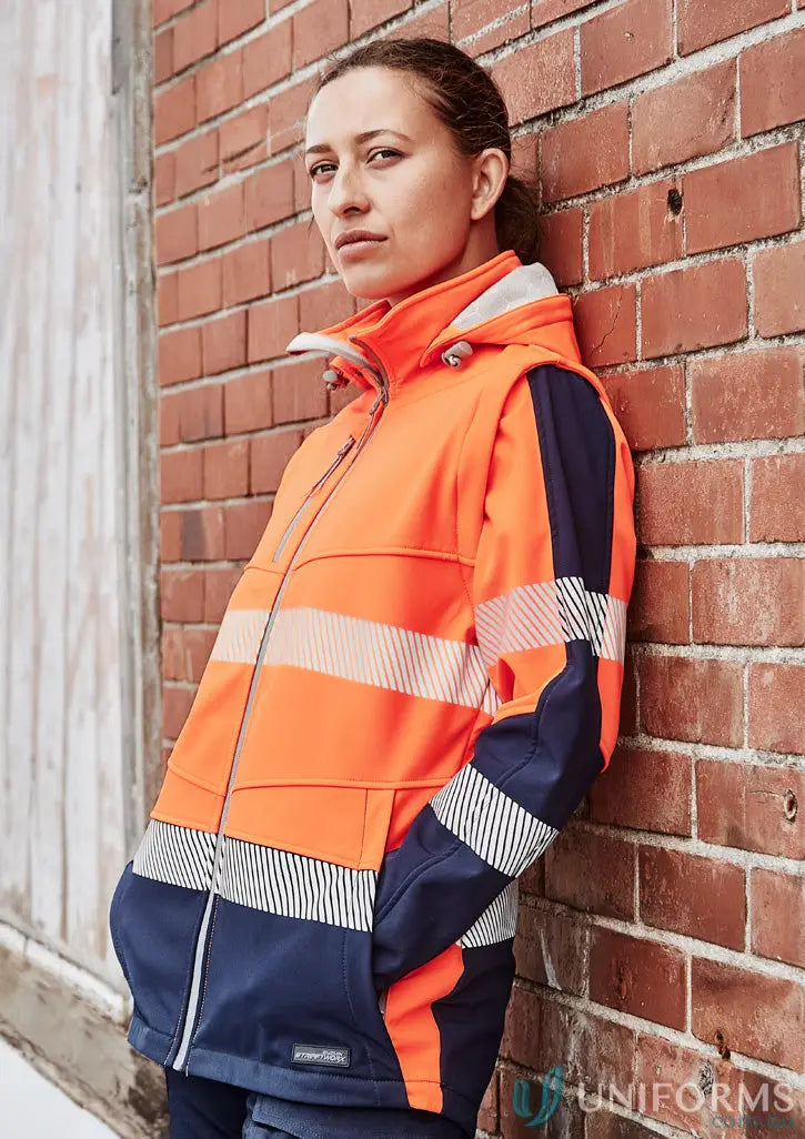 Orange and navy syzmic ladies softshell high-vis jacket with bio motion segmented design