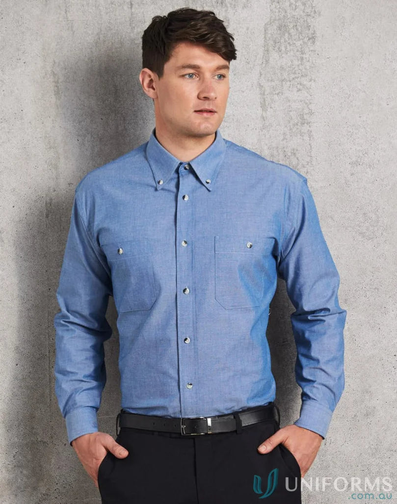 Man in a blue chambray long sleeve shirt showcasing mens chambray long style