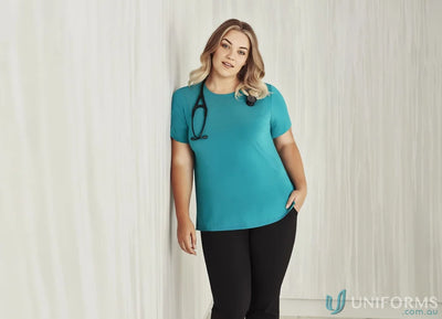 Woman in teal Bizcare Marley Soft Jersey T-Top CS952LS women’s short sleeve jersey top