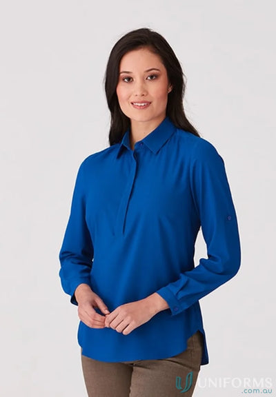 Woman wearing Meghan Top in blue action fit long-sleeve medical uniform shirt
