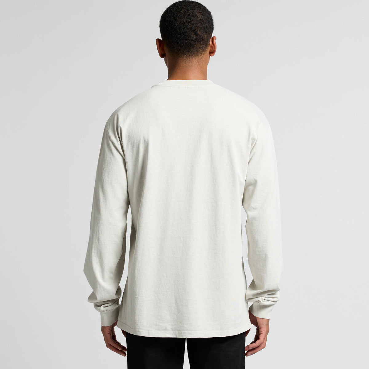 White long-sleeved t-shirt with a minimalist design and ribbed cuffs, likely made of cotton.