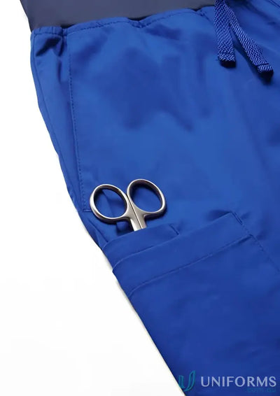 Blue Riley Slim Leg Jogger Scrub Pant with scissors in pocket for style and comfort