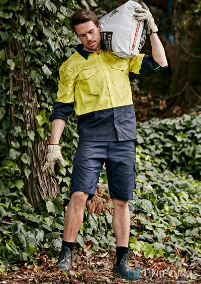 Man carrying soil in syzmik mens rugged cooling vented shorts zs505 vented