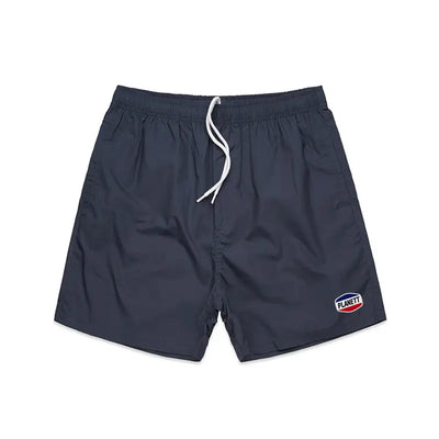 Dark navy blue nemesis beach shorts with white drawstring and logo patch perfect for casual work uniforms or beachwear