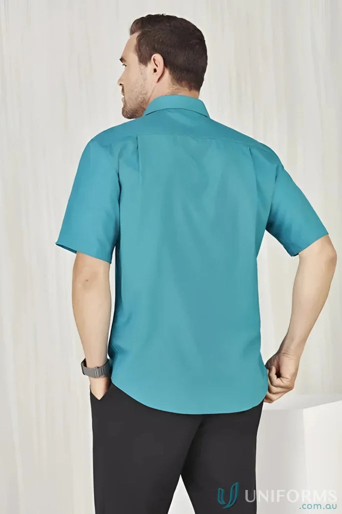 Man wearing teal Mens Oasis Short Sleeve Shirt showcasing the oasis shirt style