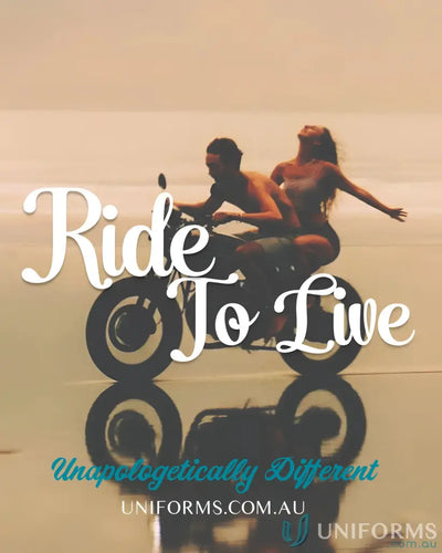 Couple riding motorcycle on beach in Podium Piping Grey Polo made with JB’s Podium Piping and Podium Cool™ fabric