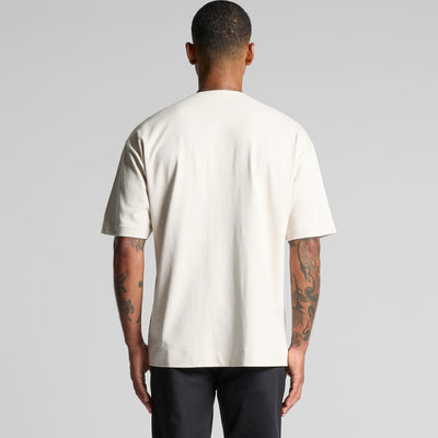 Cream-colored oversized t-shirt with a pocket and short sleeves.