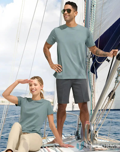 Two people in matching sailing t-shirts on a sailboat wearing the spirit premium tee