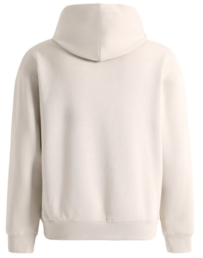 Premium oversized bone hoodie in cream color with soft textured fabric and ribbed cuffs perfect for workwear uniforms