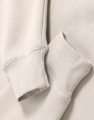 Cream-colored ribbed knit cuffs on a soft cotton premium oversized bone hoodie perfect for workwear uniforms