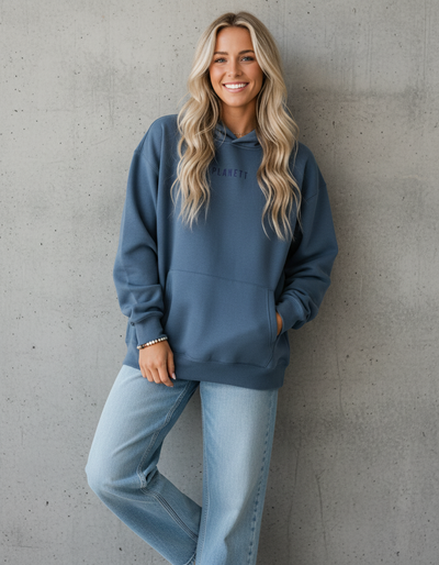 Premium oversized slate hoodie in soft blue with subtle playett logo perfect for comfortable work uniforms and workwear