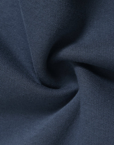 Dark blue knit fabric of a premium oversized slate hoodie with soft textured weave ideal for workwear uniforms