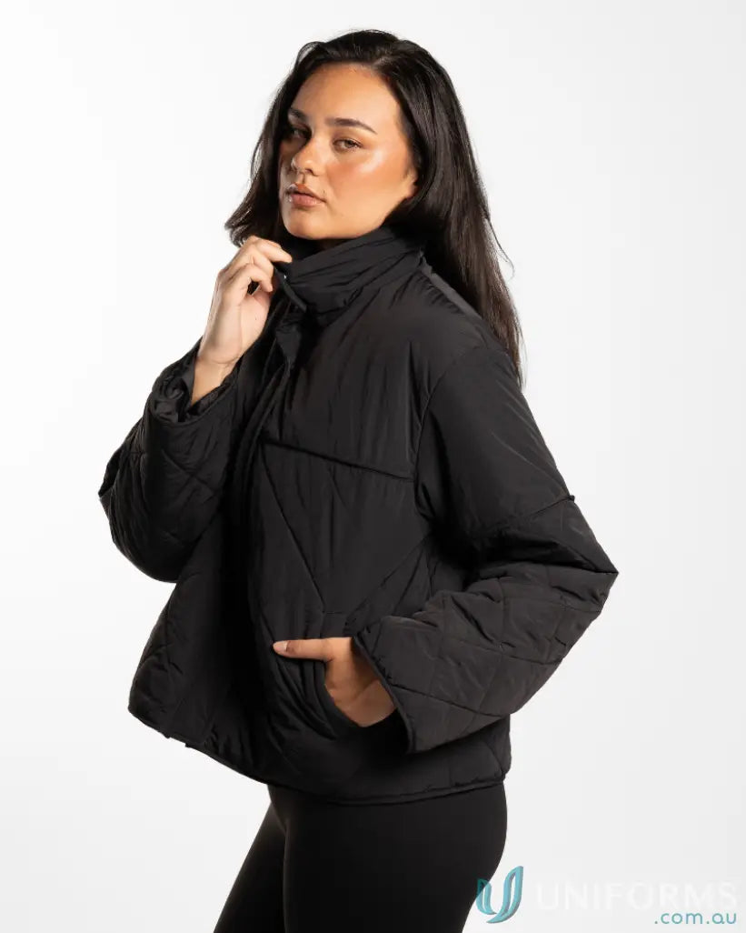 Black puffer jacket with quilted design and drawstring collar, likely made of synthetic material.