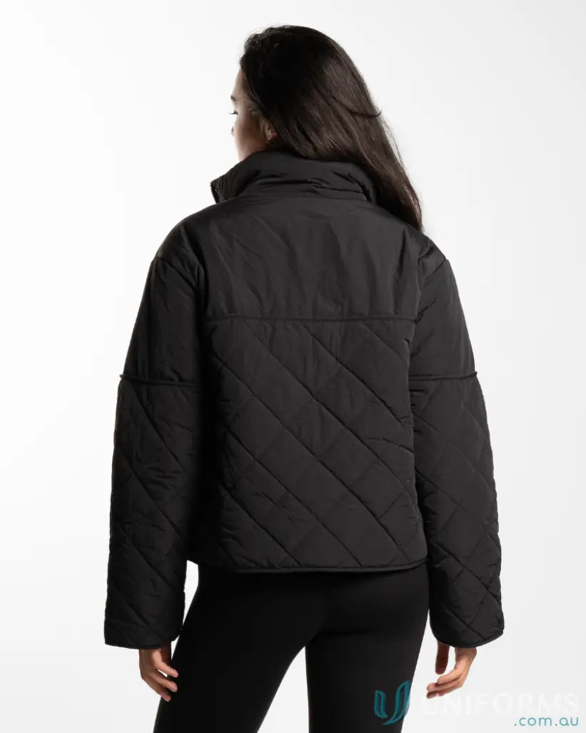 Black quilted puffer jacket with hood and zipper closure.