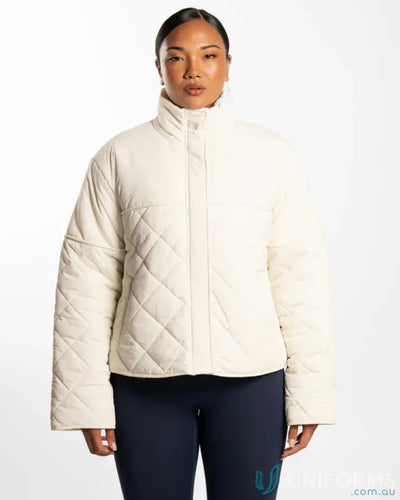 Cream quilted puffer jacket with full zip and pockets.