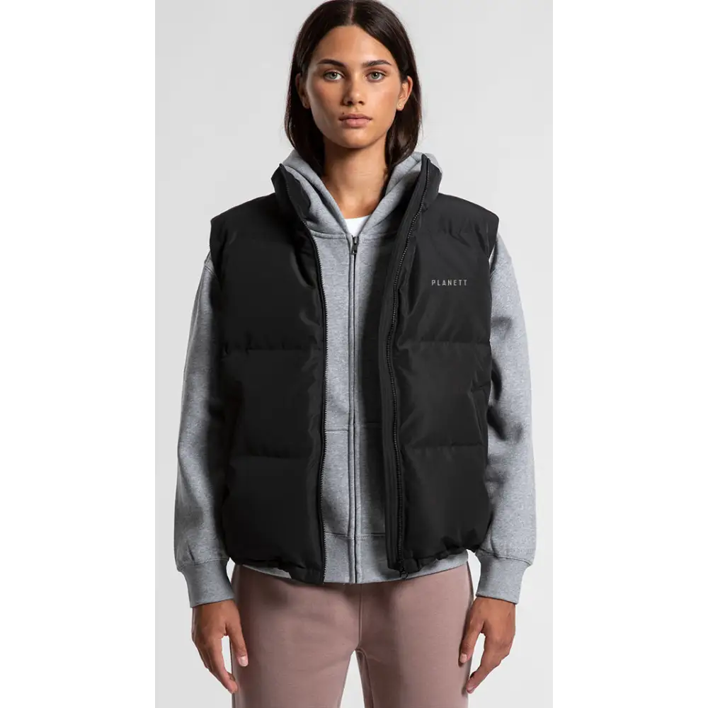 Black sarah puffer vest with hood and front zipper worn over gray hoodie ideal for workwear and uniforms