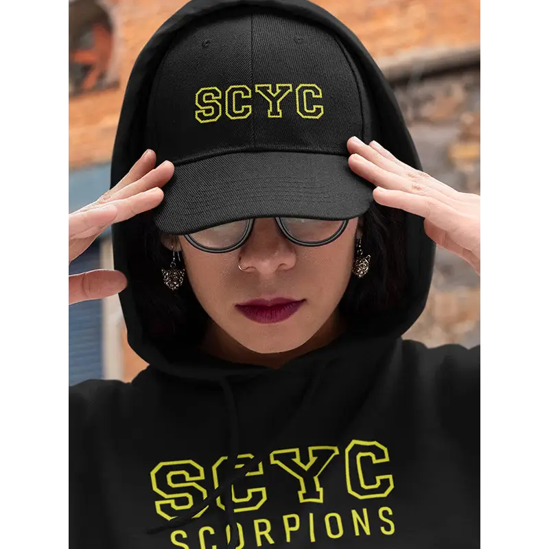 Black cap with yellow letters.