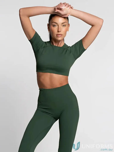 Dark green seamless cropped tee two-piece workout set with short sleeves and high-waisted leggings ideal for workwear uniforms