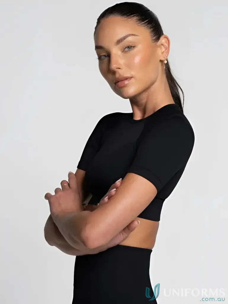 Black seamless cropped tee with high neckline and form-fitting design ideal for workwear and uniforms
