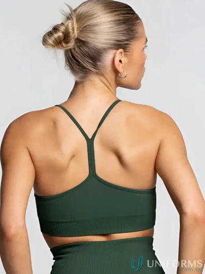 Dark green seamless sports bra with crisscross back design perfect for activewear work uniforms and workwear needs