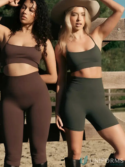 Brown leggings with a ribbed texture and elastic waistband, made of stretchy fabric.