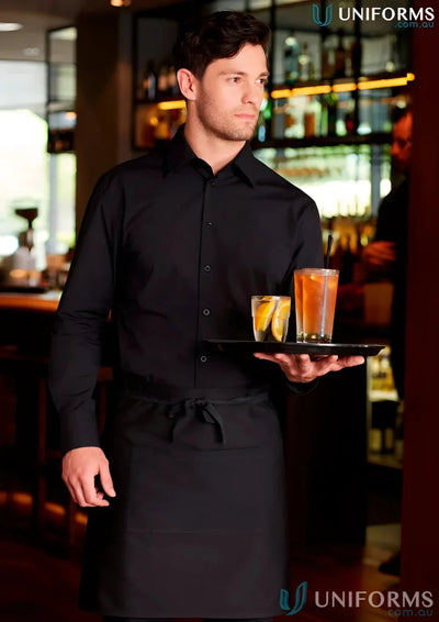 Waiter in black uniform holding drinks wearing a short waist apron for a sleek look