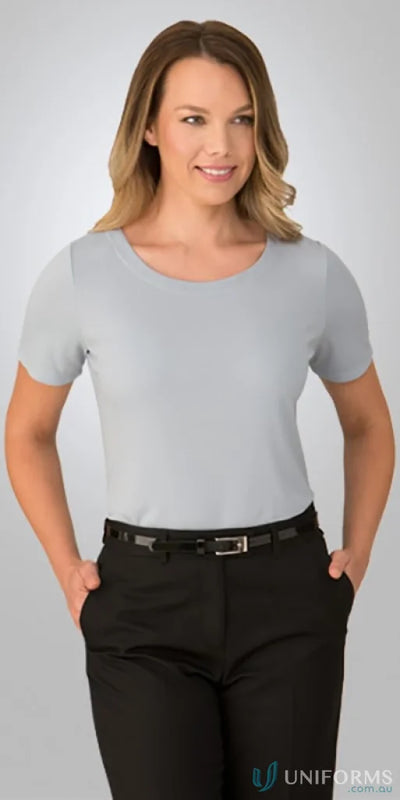 Woman in stretch gray top with short sleeves, perfect for uniforms and casual wear