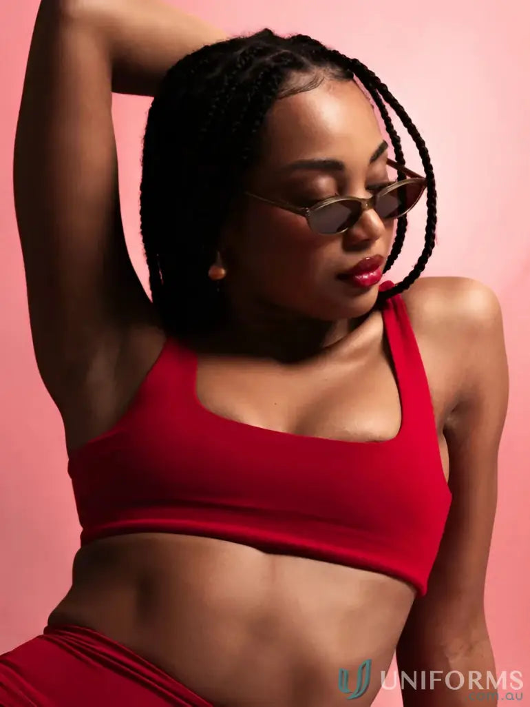 Red cropped sports bra with thin straps and square neckline perfect for work uniforms or casual workwear looks