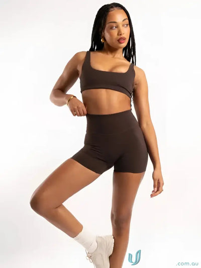 A sleek solid brown stretchy two-piece athletic set perfect for comfy uniforms or casual workwear looks