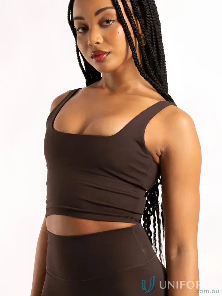 A sleek dark brown cropped tank top with square neckline and ruching perfect for stylish workwear uniforms
