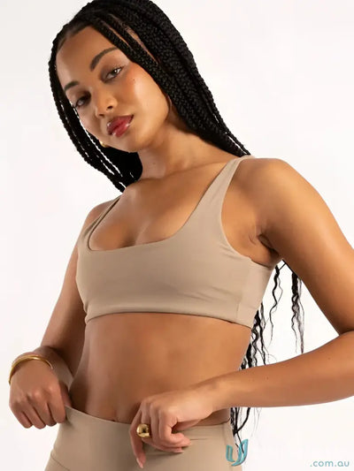 Beige seamless square neck latte crop sports bra with thin straps and scoop neckline perfect for workwear uniforms