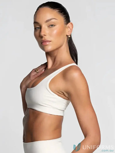 White cropped sports bra with thin straps and minimalist design perfect for work uniforms and casual workwear