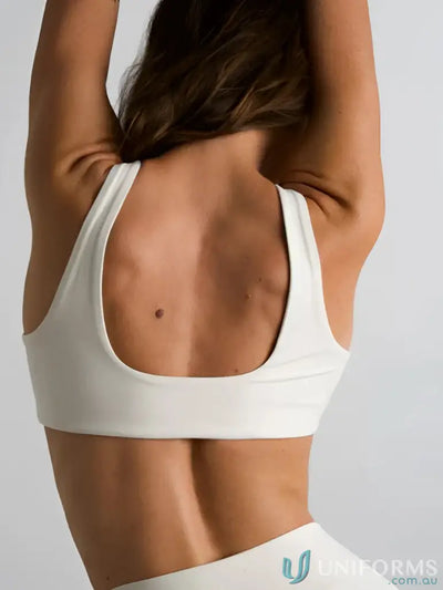 White sports bra with wide supportive straps and minimalist square neck design ideal for workwear uniforms