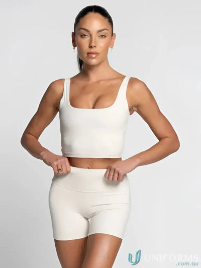 White cropped tank top with square neckline and thin straps perfect for casual workwear or uniforms in offwhite color